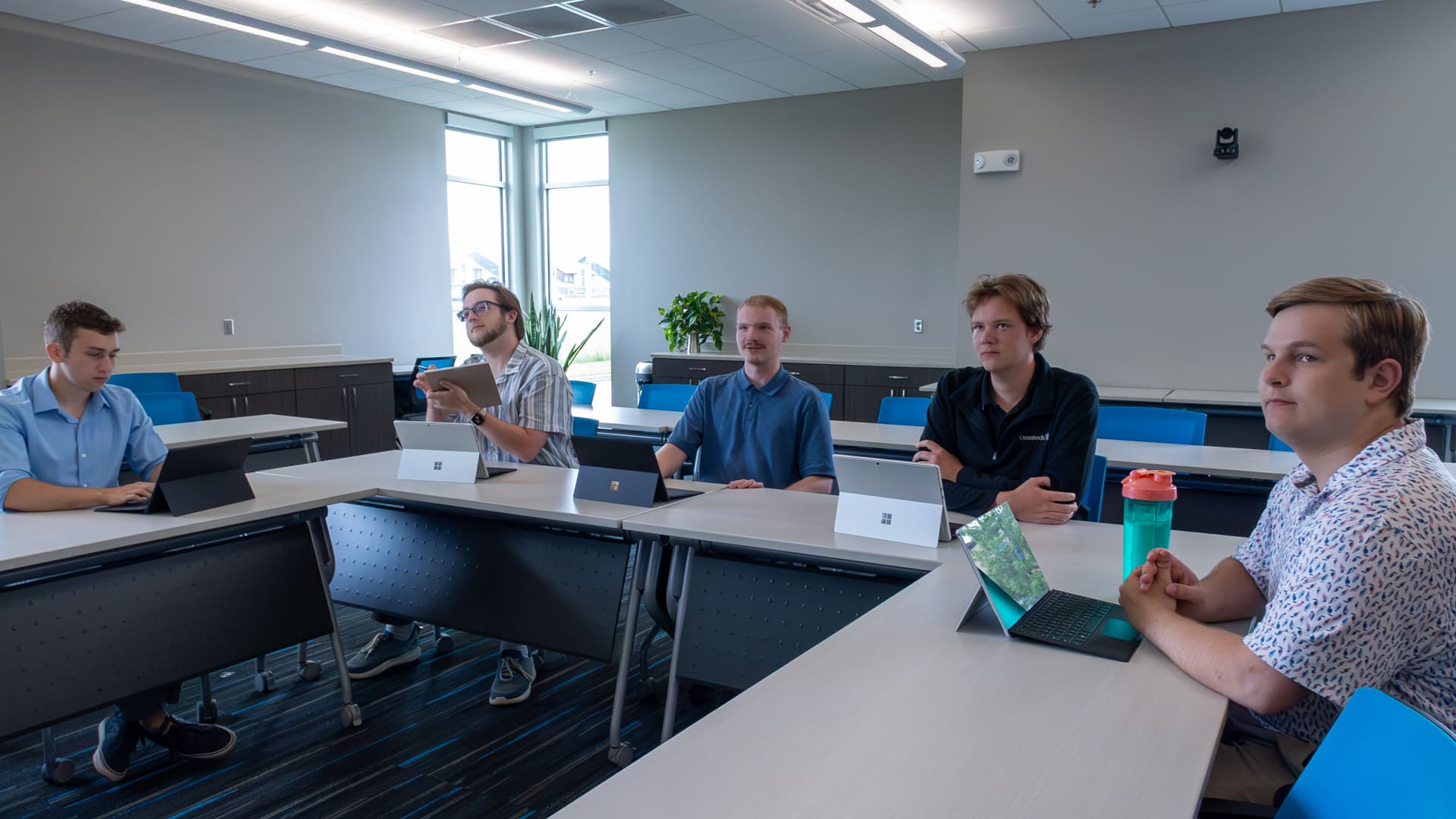 Interns collaborating together in the conference center